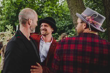 Groom greeting guests.
