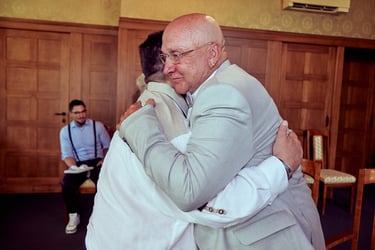 Groom hugging his best man.