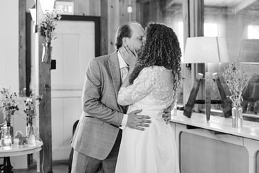 Bride and groom kissing for the first time as husband and wife.