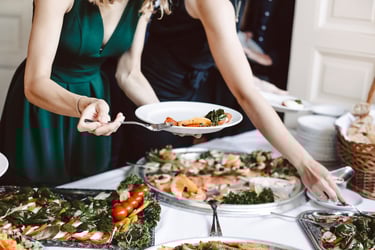 A wedding guest serving herself the anti-pasti.
