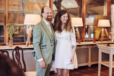 Bride and groom standing in front of guests after the ceremony.