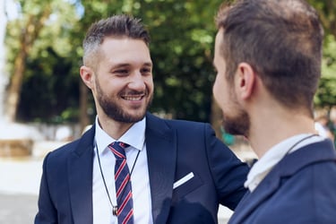 Groom gazing into his husband's eyes.