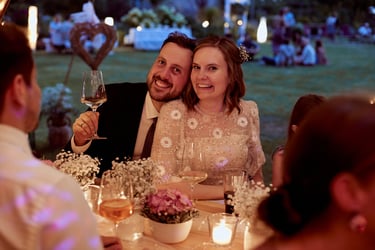 Bride and groom during reception light by candles.