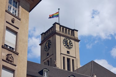 Tempelhof-Schöneberg civil registry building with a pride flag on top.