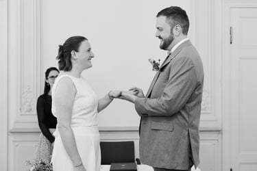 Couple exchanging rings during a civil ceremony.