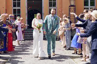 Bride and groom having a send-off outside Gusthaus Steglitz.