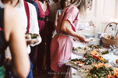 Wedding guests helping themselves to food.