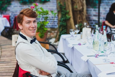 Red haired wedding guests sitting at a table.