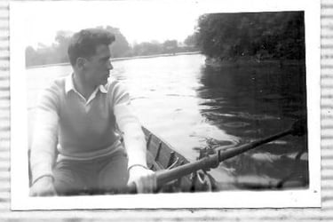 Dad rowing a small boat