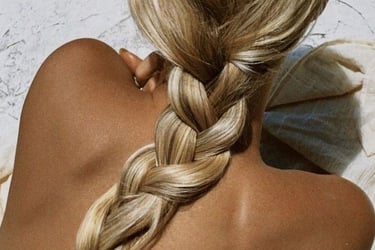 a woman with braided hair beach social media marketing