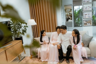 a family sitting on a couch in a living room