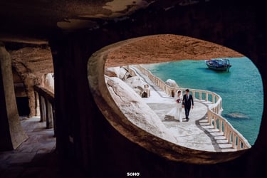 a couple of people walking down a path