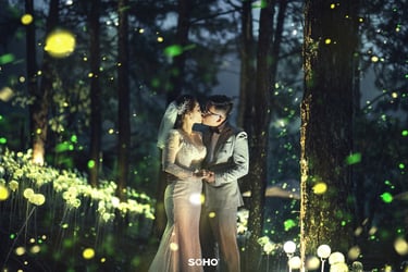 a couple kissing in a forest