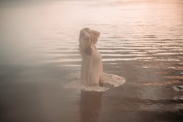 Dreamy maternity photo of mother standing in the water, Grand Rapids MN