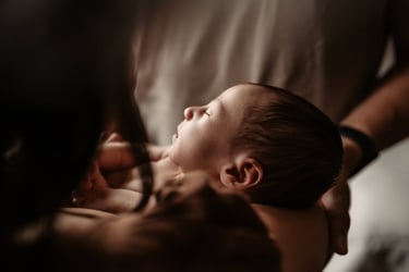 Lifestyle newborn photo showing baby’s profile, Duluth MN photographer