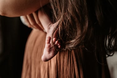 Detail of newborn foot entangled in mother’s hair, Grand Rapids MN