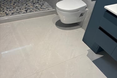 a bathroom with a shower and a shower clean floor and bathroom on post construction job
