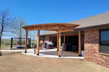 a patio with a cedar pergola