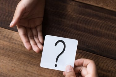 a person holding a card game card game