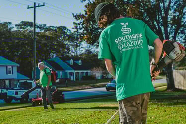 Modern Lawn care equipment including edger and leaf blower at work