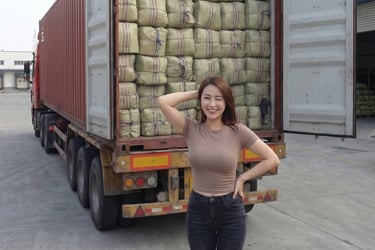 international export buyer standing behind a container of dried Gracilaria seaweed, Indonesia
