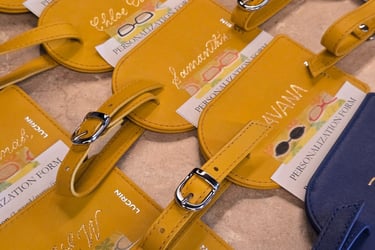Live personalized bag tags by Handwritten by Belle for a corporate event.