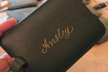 Live hot foiling on luggage tags for a NYC conference by Handwritten by Belle.