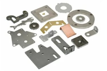 a variety of sheet metal parts including a gear set