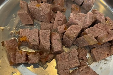 Close up of Edgard & Cooper Game & Duck wet food showing texture