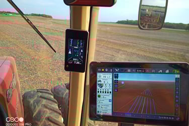 a tablet computer screen showing a tablet and a tablet with a view of a tractor