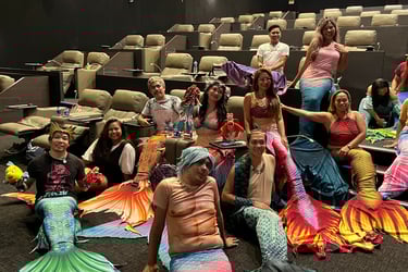 mermaids celebrating together in a cinema