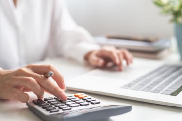 Accountant calculating what revenue they could generate with referring home loan leads to Cromeloan