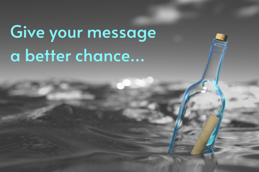 On-hold Message in a coloured bottle bobbing in a greyscale ocean
