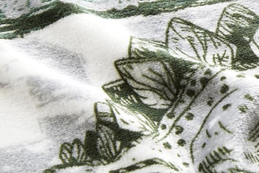 Polyester dino printed fleece fabric swatch