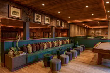 Solo Home Decor custom banquette with velvet pillows in a warm modern lounge with wood accents in Los Angeles.