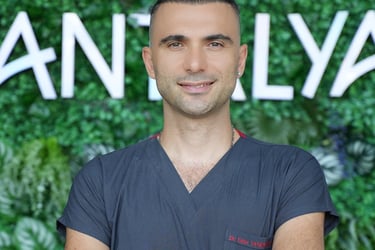 a man in a gray shirt and a watch on his wrist