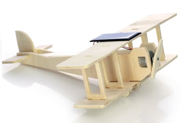 Wooden biplane model equipped with a functional motorized spinning electronic propeller.