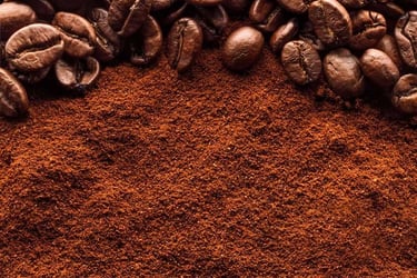 a pile of coffee powder and coffee beans