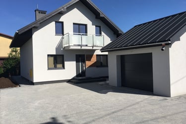 a house with a garage door and a garage door
