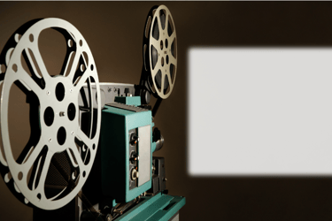 a movie projector with a screen