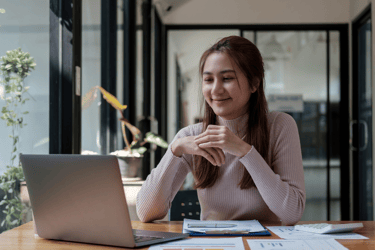 "Female therapist conducting an online consultation from a modern office setting via laptop"