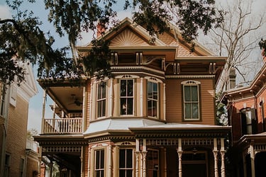 alt="Newly painted victorian house"