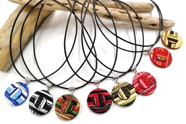 a bunch of necklaces with different designs