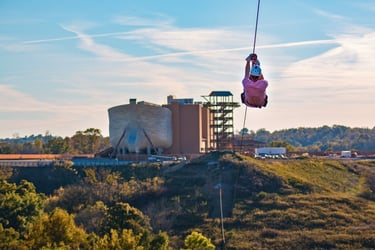 a person is hanging from a zipline