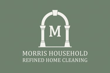 Morris Household logo. White archway with capital M.