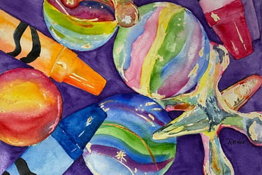 Marbles in rich jewel tones, swirling greens, golds, blues and pinks sparkling in light kids toys