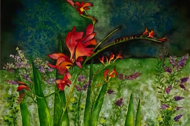 Bursting red, orange and yellow flowers in delightful Spring amid vivid greens of many shades