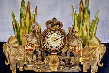 Decorative roman numeral clock flanked by ornate golden elephants and spiked green gold leaves