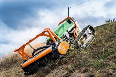 Green Climber F 23 Model mowing vegetation on steep hillside