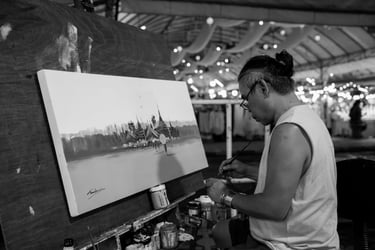 In the old town of Chiang Mai, Thailand, a street performer is at work.